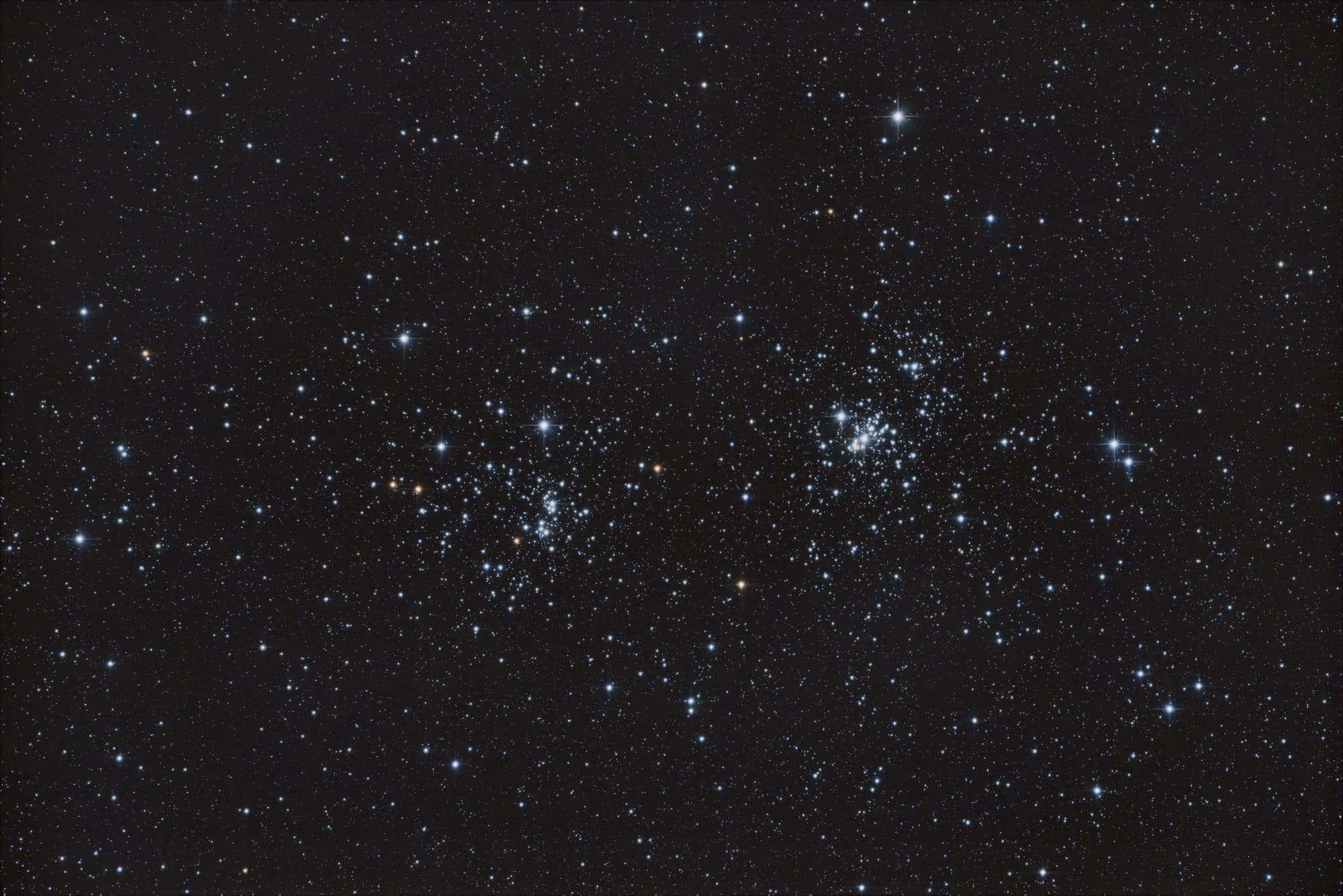 The Double Cluster: Twin Jewels on the Sword of Perseus
